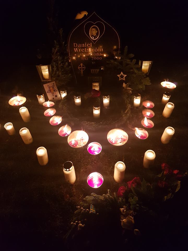 Candles at the grave of Daniel Wretström on the anniversary of his death, 9 Dec 2018.