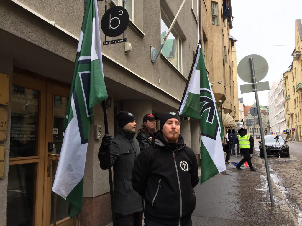 Nordic Resistance Movement activists protest against white genocide outside South African embassy in Helsinki, Finland