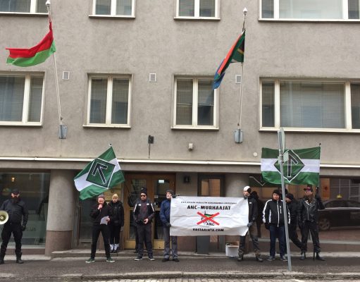 Nordic Resistance Movement activists protest against white genocide outside South African embassy in Helsinki, Finland