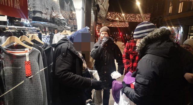 Nordic Resistance Movement activists give supplies to the homeless in Oslo