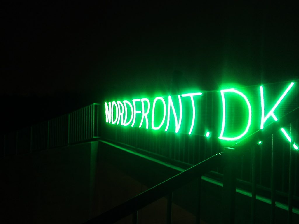 Danish Nordic Resistance Movement activists advertise the branch’s website with a glowing LED banner in Glostrup, Copenhagen