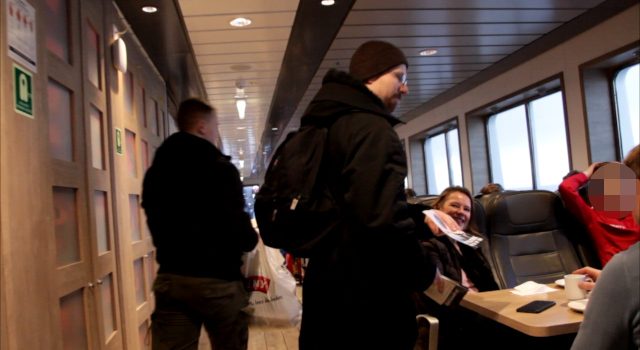 Nordic Resistance Movement activists leaflet on a ferry in Norway