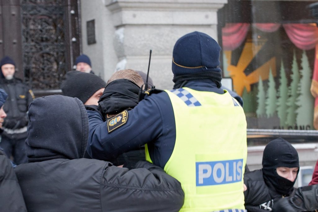 Undercover police arrest a young man for thought crime at a freedom of speech demonstration in Stockholm