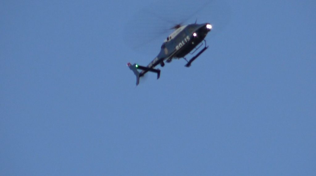 A police helicopter monitors a Nordic Resistance Movement activity in Stenungsund