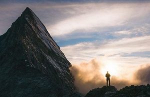 Man standing before a mountain