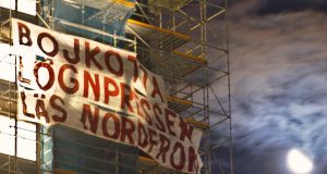 Nordic Resistance Movement banner on Dagens Nyheter Tower, Stockholm