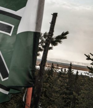 Nordic Resistance Movement flag in the forest