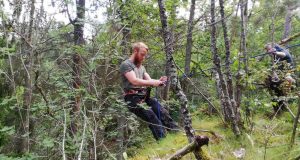 Abseiling in the forest in Sweden's Nest 7