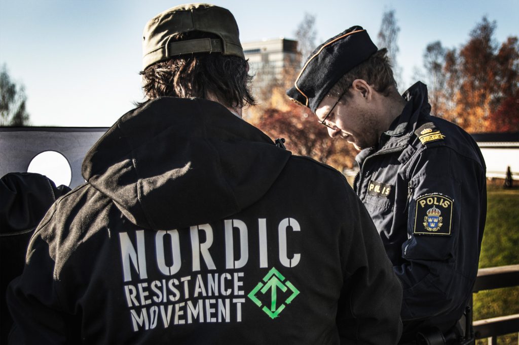Nordic Resistance Movement Nest 6 "Love Your People" banner action police harassment