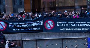 Nordic Resistance Movement banners at vaccine passport demonstration in Stockholm