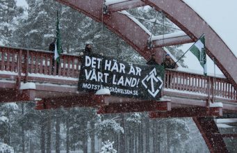 Nordic Resistance Movement banner action in the snow in Sollefteå, Sweden