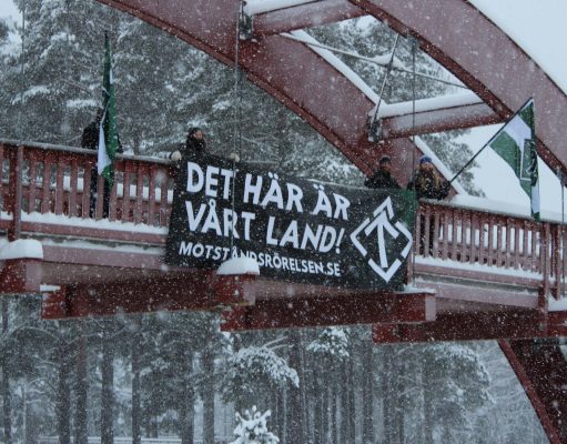 Nordic Resistance Movement banner action in the snow in Sollefteå, Sweden