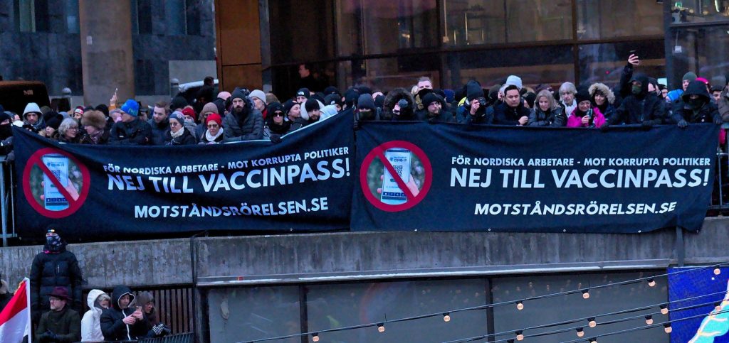 Nordic Resistance Movement banners at Covid-19 vaccine passports demonstration, Stockholm