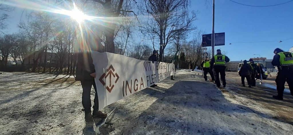 Nordic Resistance Movement "No More Brother Wars" banner at anti-Ukraine war protest, Stockholm, Sweden
