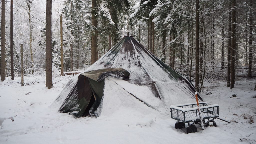 Snow-covered tent in a Scanian forest, Sweden