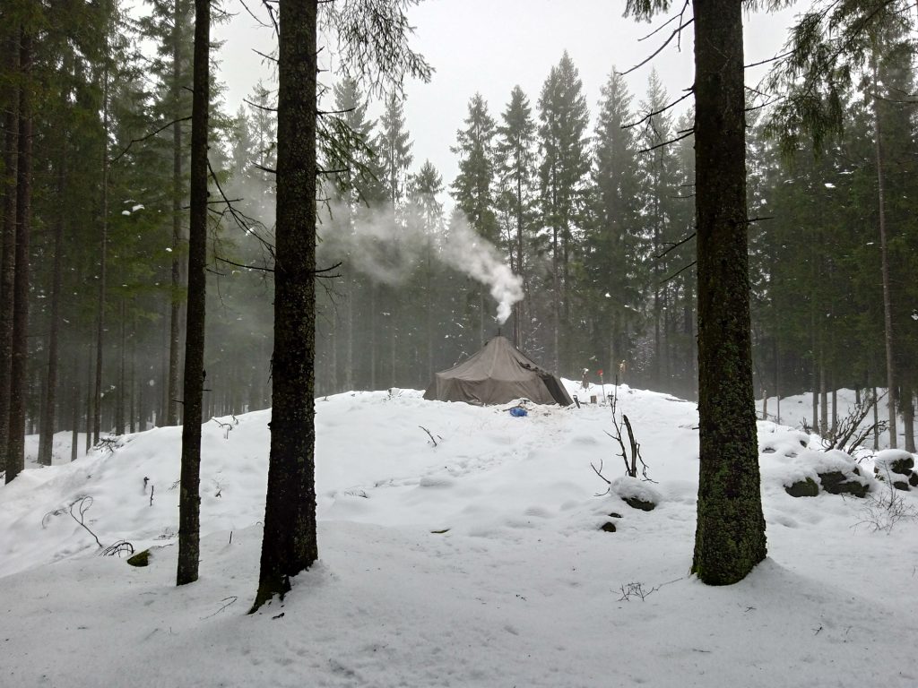 Snow-covered tent in a Scanian forest, Sweden