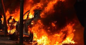 Burning car in a riot