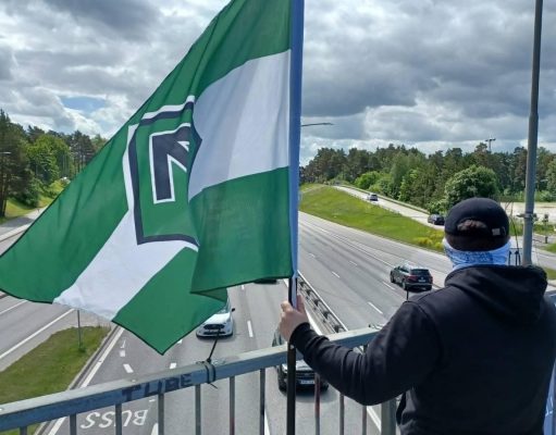 Nordic Resistance Movement activist at banner action on Stockholm bridge