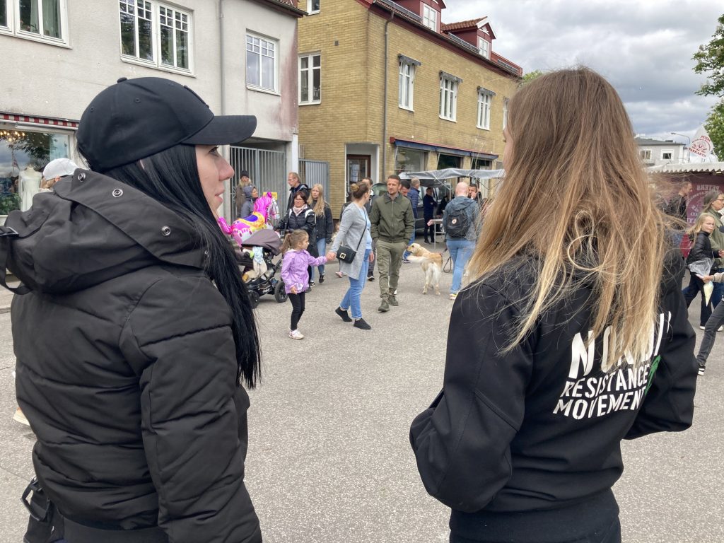 Nordic Resistance Movement female activists at public activity in Örkelljunga, Sweden
