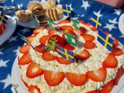Strawberry cream cake with flags served on Sweden's National Day