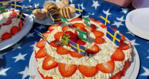Strawberry cream cake with flags served on Sweden's National Day