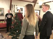 Nordic Resistance Movement members stand around Christmas tree at meeting