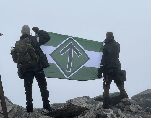Nordic Resistance Movement flag on summit of Galdhøpiggen, Jotunheimen, Norway
