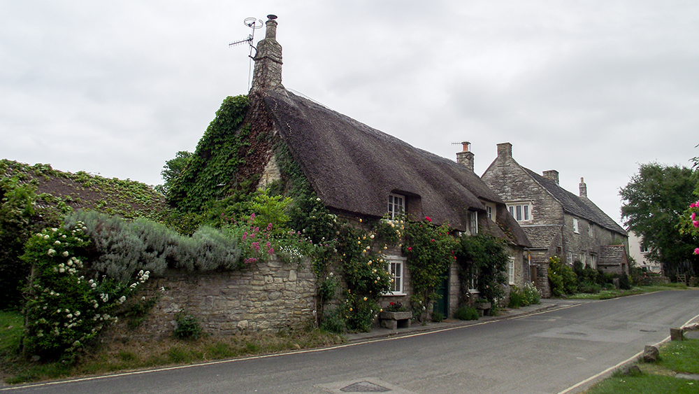 Thatched roof stone house in England