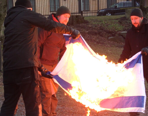 Nordic Resistance Movement activists burn Israeli flag at demonstration outside Israeli embassy, Stockholm