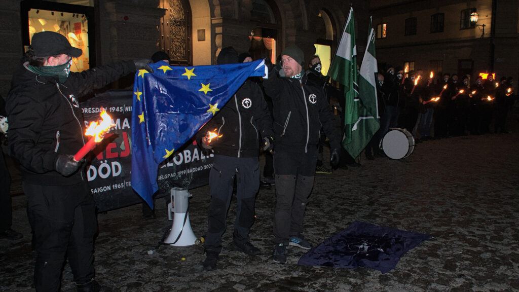 Nordic Resistance Movement Stockholm Dresden Nato protest burning EU flag