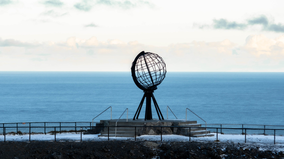 Globe monument on the shores of the Arctic Ocean in Norway